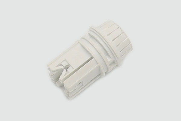white connector created by injection molding parts supplier